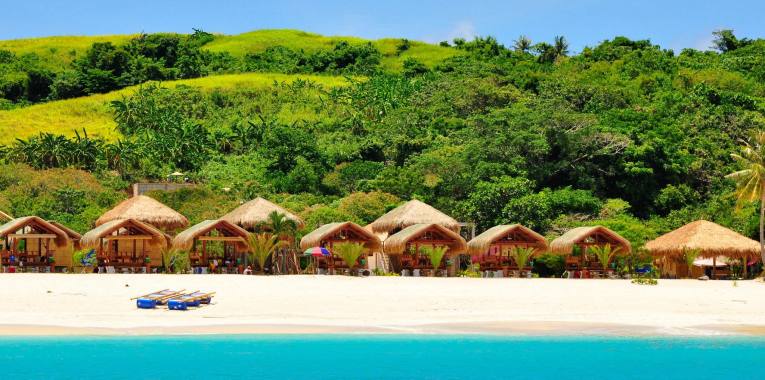 Traditional huts at Mahabang Buhangin Beach.