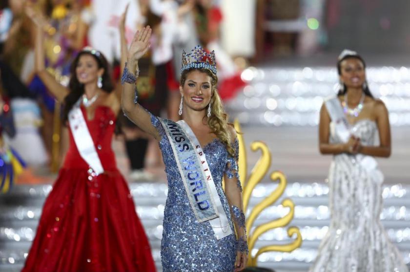 Newly crowned Miss World Mireia Lalaguna Royo from Spain celebrates after at the end of the 2015 Miss World Grand Final in Sanya in south China's Hainan province Saturday Dec. 19, 2015. Spain's Mireia Lalaguna Royo was named the winner of the Miss World 2015 competition Saturday night in the southern Chinese island resort of Sanya, an event dogged by controversy over China's refusal to allow Canada's entrant to attend. (Chinatopix Via AP) CHINA OUT
