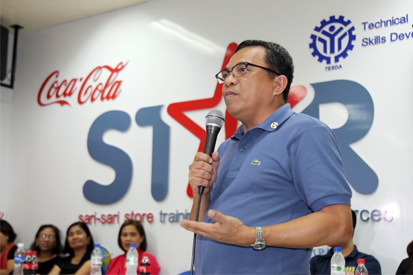 Labor Undersecretary Nicon Fameronag congratulates the first batch of WOMEN REACH! graduates, 43 former OFWs and immediate family members of OFWs, during a ceremony at the STAR Center for Excellence facility at the TESDA Women’s Center.