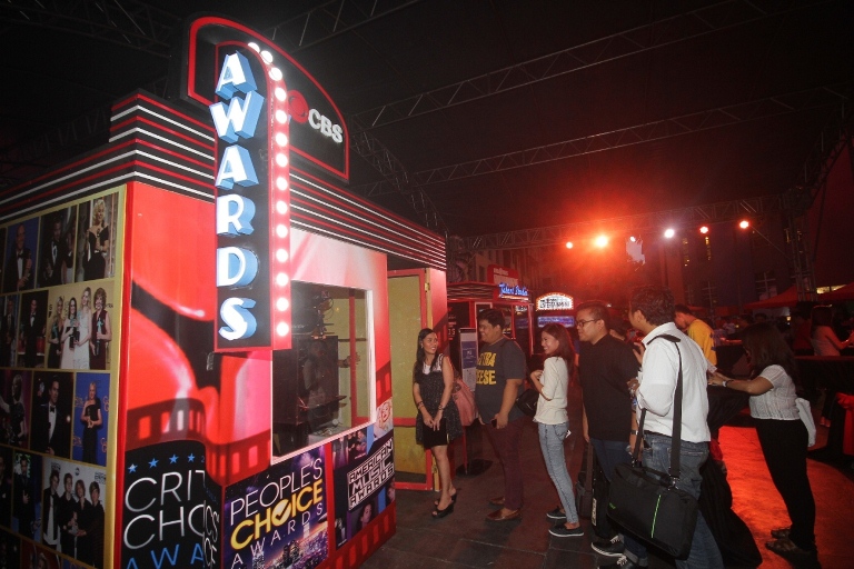 STRUTTING THE RED CARPET Fair goers queue for that _Golden Globe winning moment_